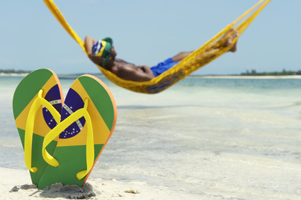 Man Relaxes in Hammock on Brazilian Beach